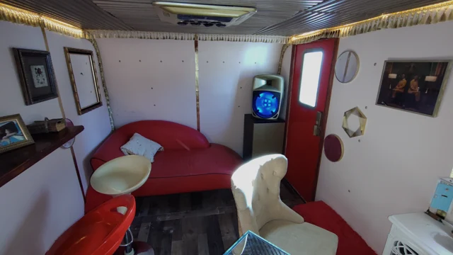 A wide view of the actual seating layout and red-door end of the lounge.